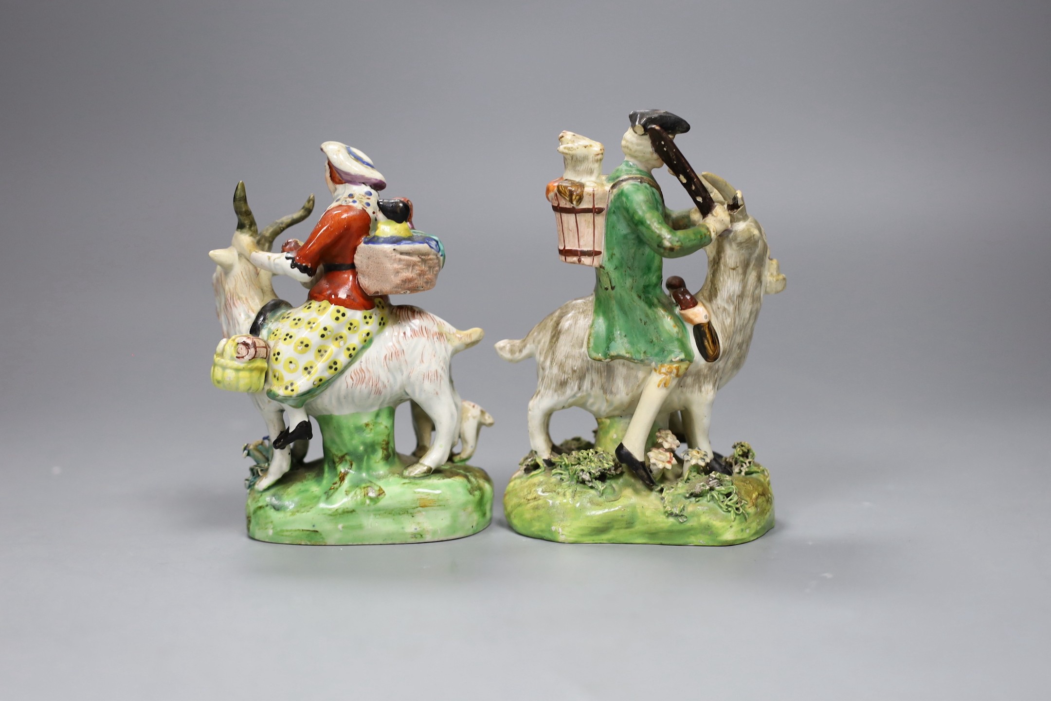 A near pair of pearlware groups Tailor and his wife, c.1820, tallest 13.5cm
